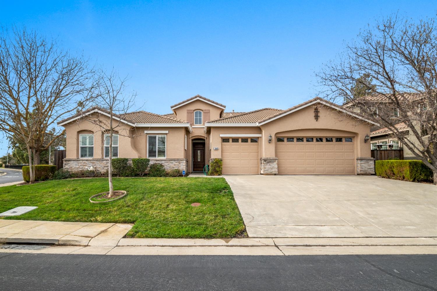 18040 Ruddy Street Woodland, CA 95695 - Photo 2 of 40 a front view of a house with a yard