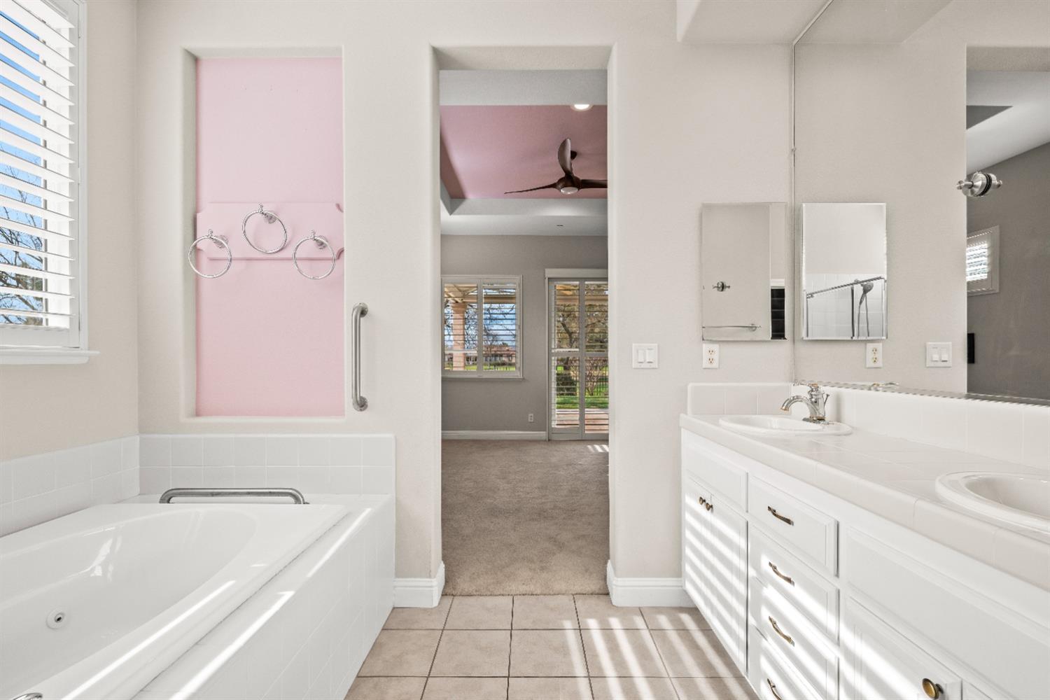 18040 Ruddy Street Woodland, CA 95695 - Photo 22 of 40 a bathroom with a tub sink and mirror