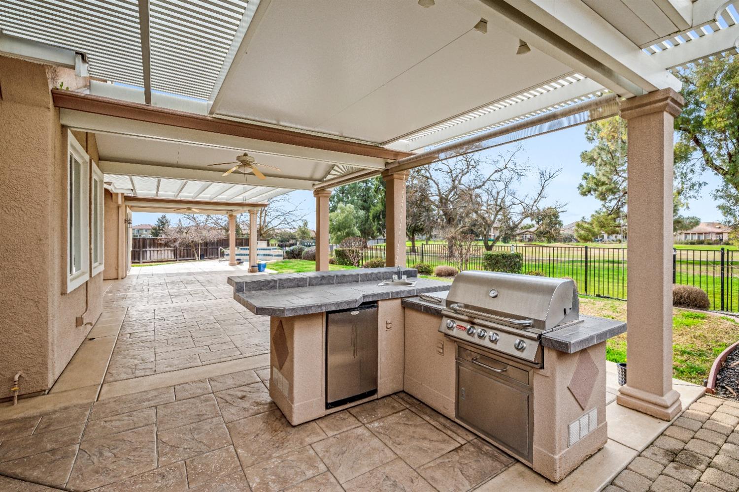 18040 Ruddy Street Woodland, CA 95695 - Photo 31 of 40 a open kitchen with stainless steel appliances granite countertop a sink and a stove
