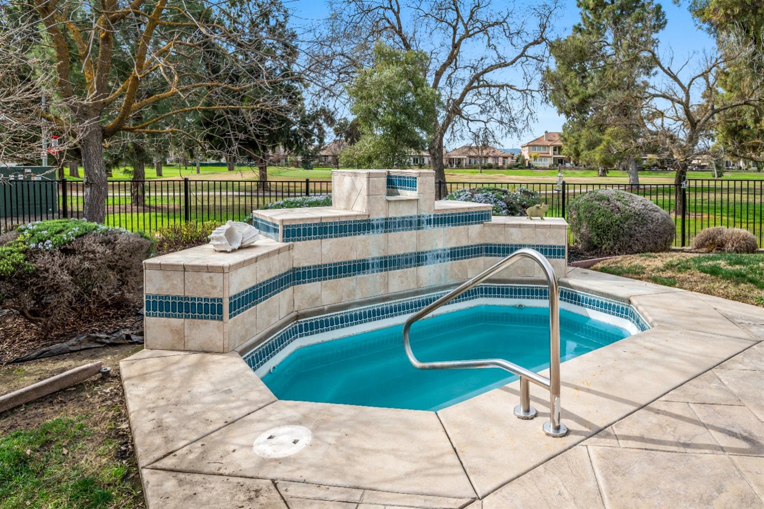 18040 Ruddy Street Woodland, CA 95695 - Photo 34 of 40 a view of a swimming pool with a patio and a garden