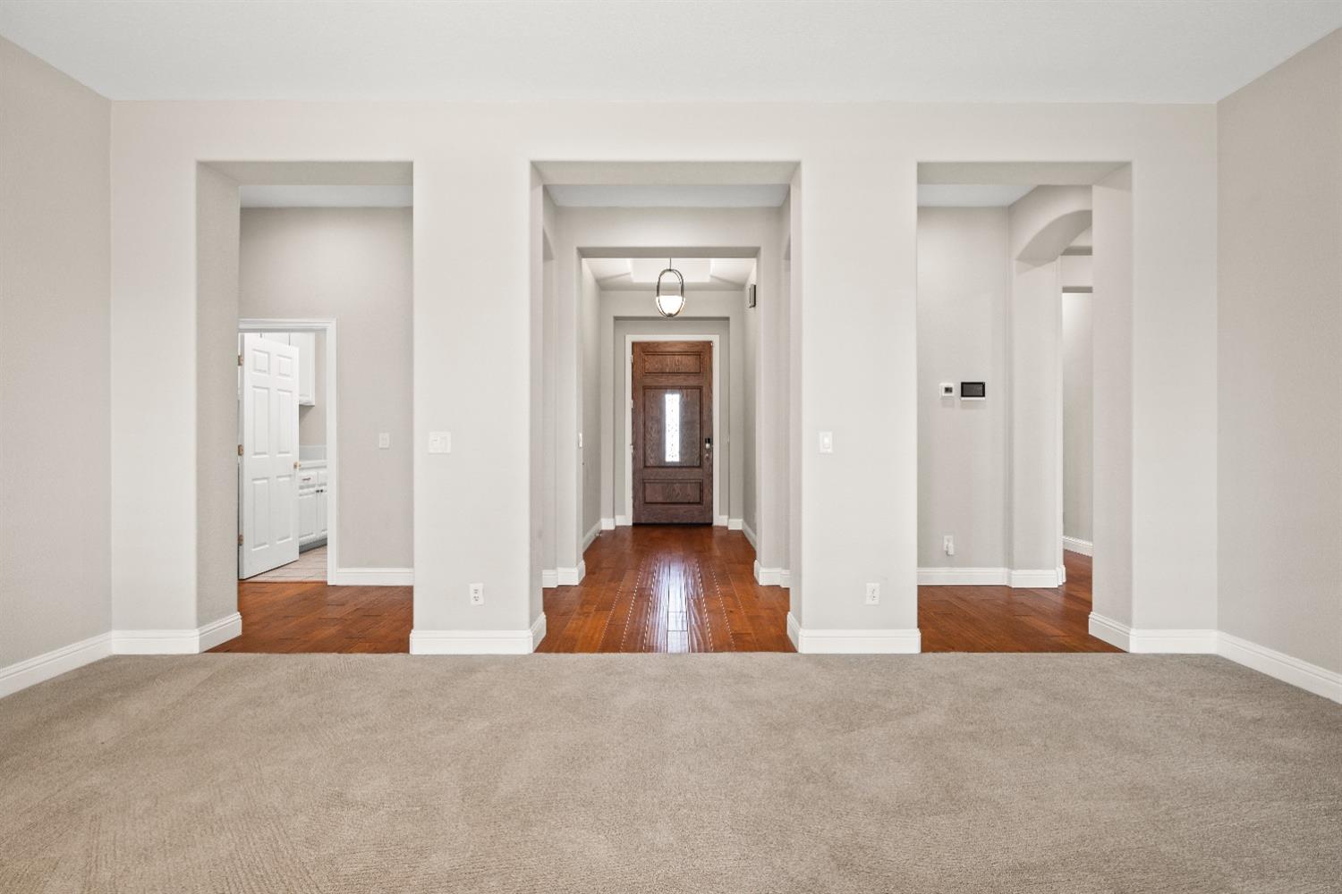 18040 Ruddy Street Woodland, CA 95695 - Photo 5 of 40 a view of a hallway with wooden floor and closet