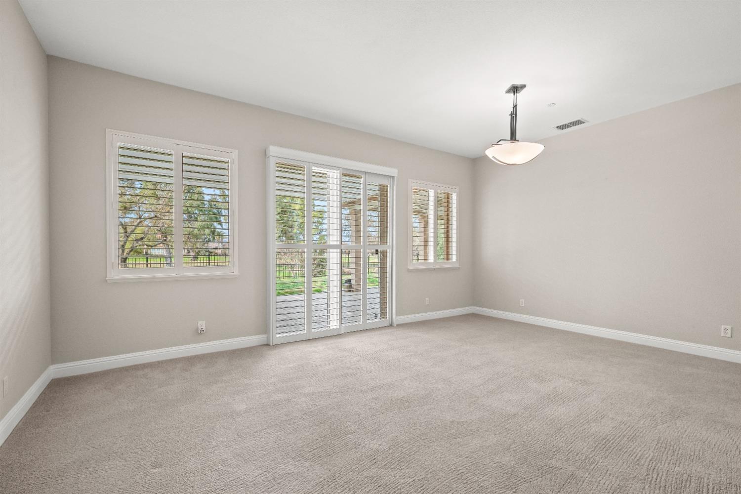 18040 Ruddy Street Woodland, CA 95695 - Photo 6 of 40 an empty room with windows