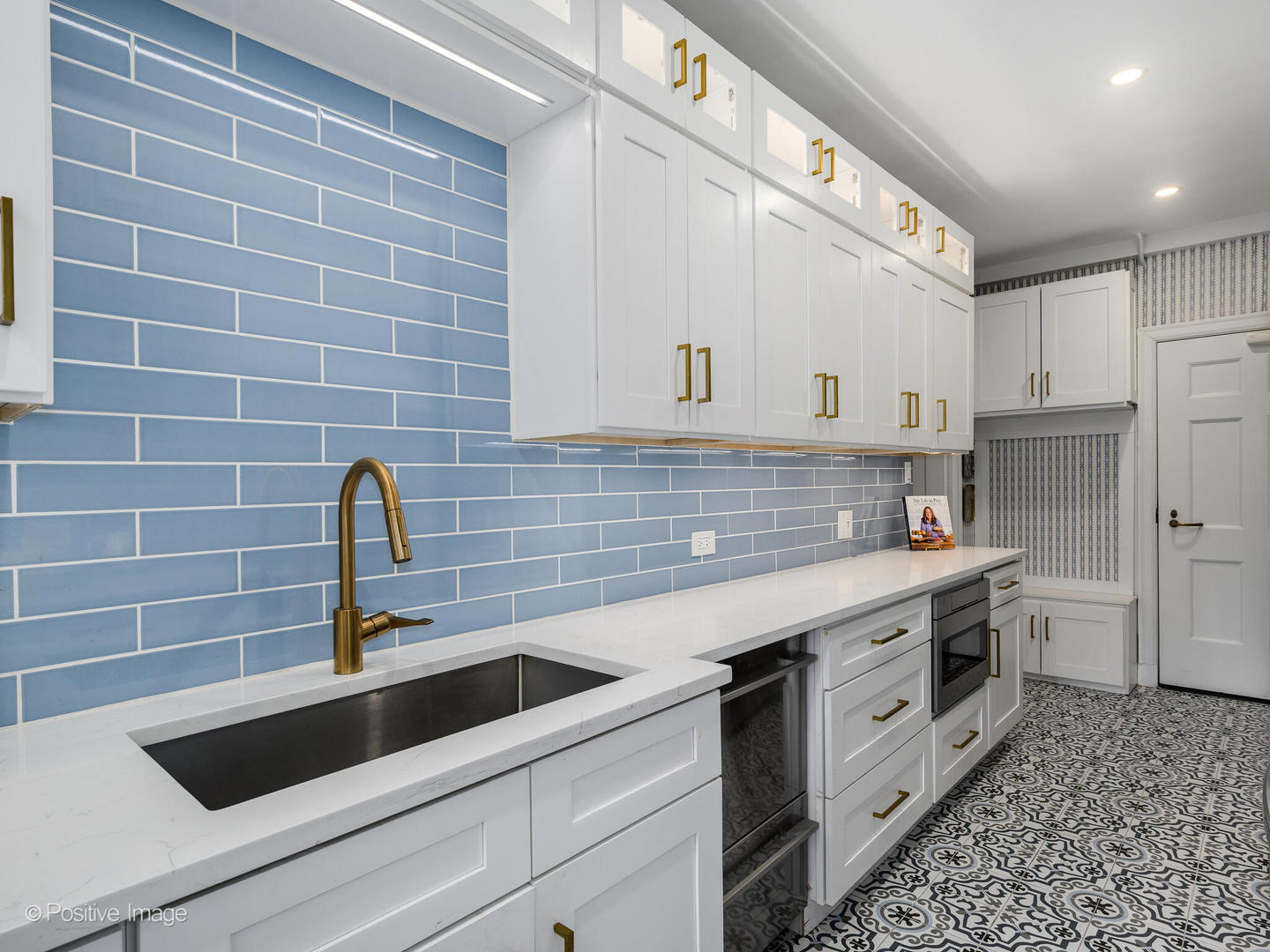 73 East Elm Street, Unit 4B Chicago, IL 60611 - Photo 11 of 27 a kitchen with a sink and cabinets