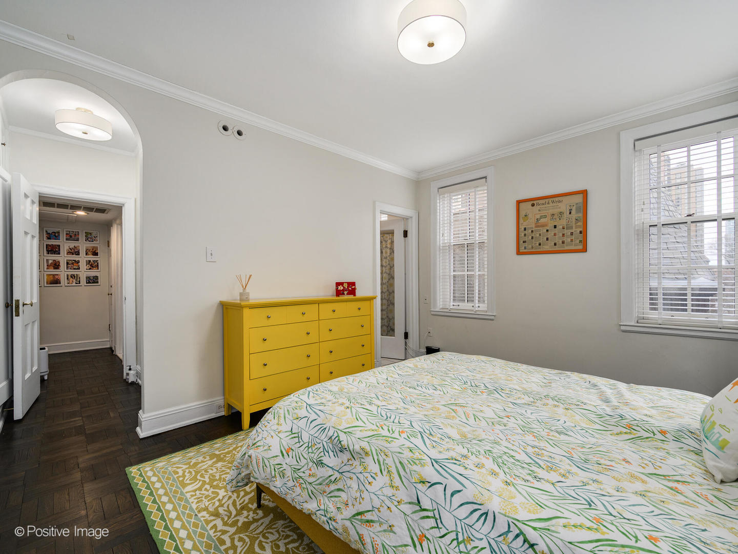 73 East Elm Street, Unit 4B Chicago, IL 60611 - Photo 20 of 27 a bedroom with a bed and wooden floor