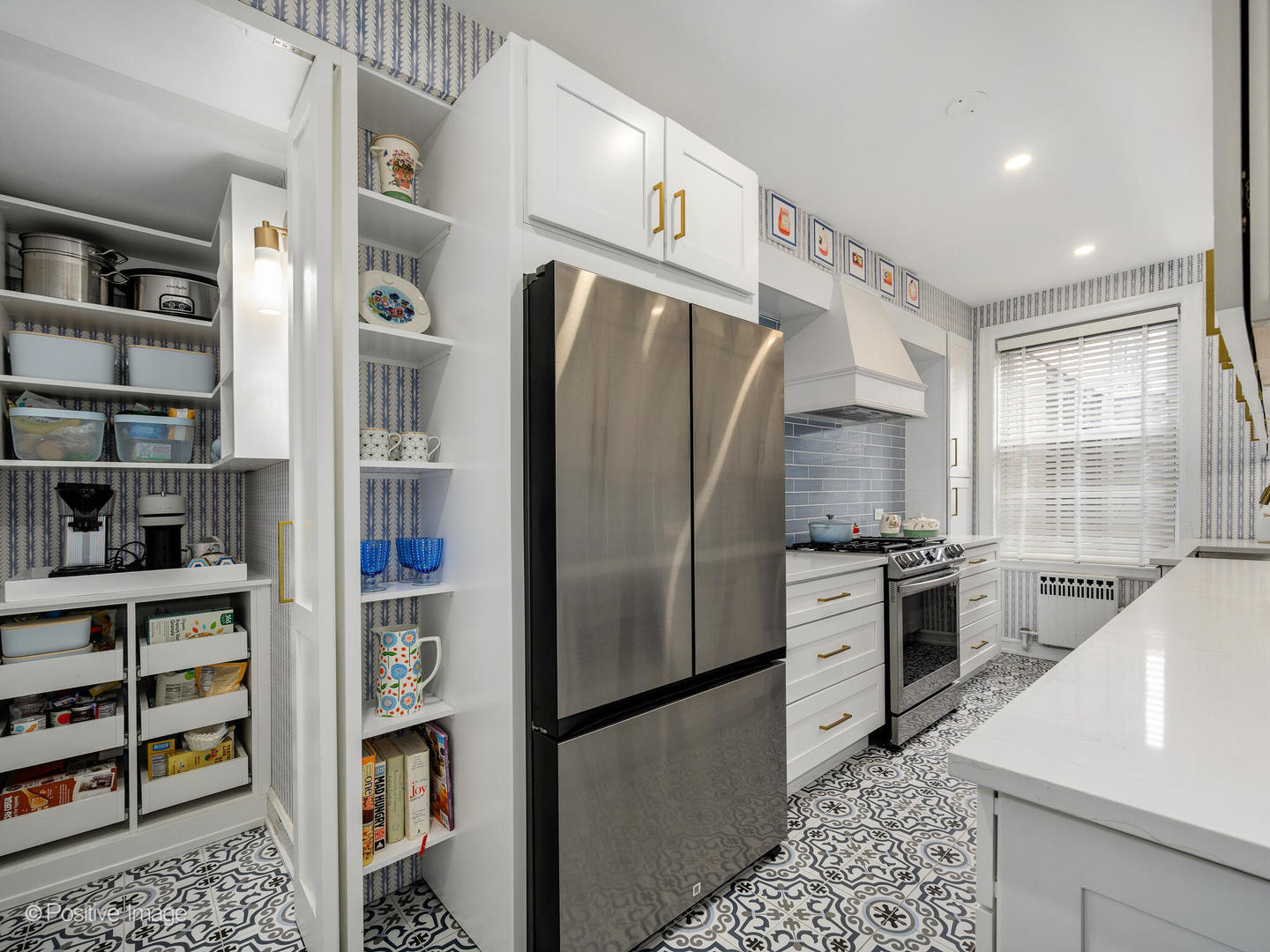 73 East Elm Street, Unit 4B Chicago, IL 60611 - Photo 8 of 27 a kitchen with stainless steel appliances granite countertop a refrigerator and a stove top oven