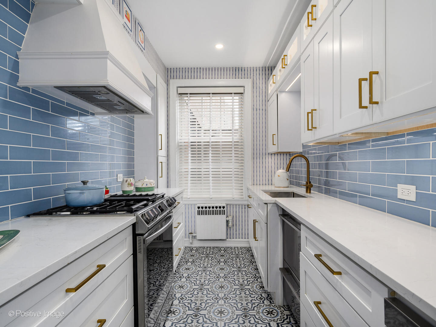 73 East Elm Street, Unit 4B Chicago, IL 60611 - Photo 9 of 27 a kitchen that has a sink and a stove