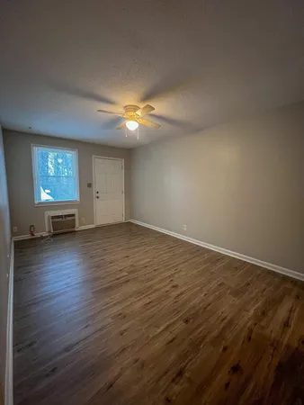 a kitchen with a refrigerator and a stove top oven