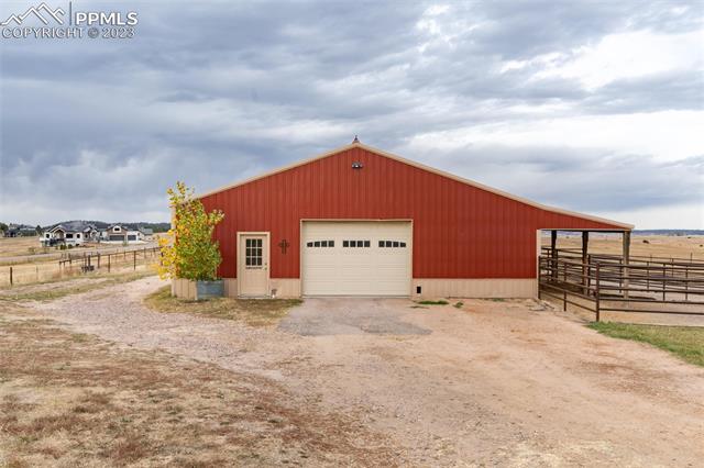 16850 Steppler Road Colorado Springs, CO 80908 - Photo 30 of 36 Steel barn with 5 stalls, wash rack, tack room and hay storage.
