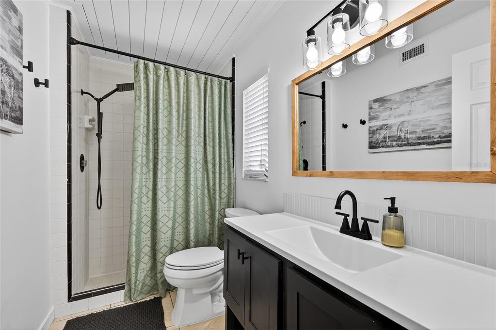 532 Center Road Venice, FL 34285 - Photo 34 of 68 a bathroom with a sink a toilet and shower