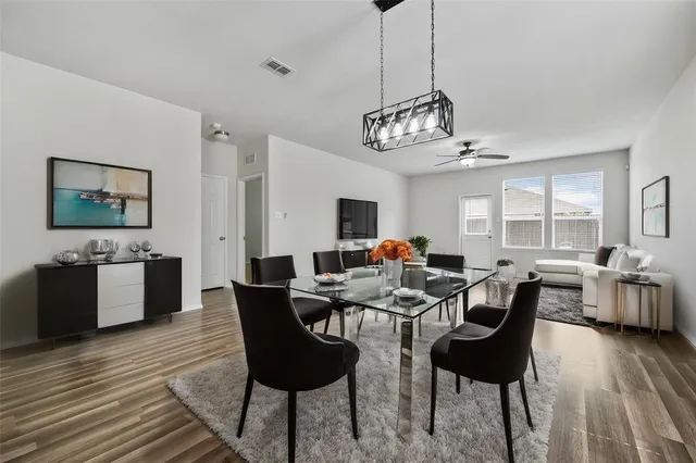 a view of a dining room with furniture window and wooden floor