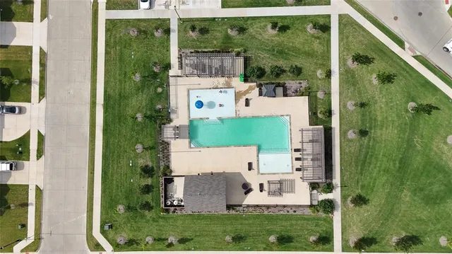 aerial view of a house with pool and plants