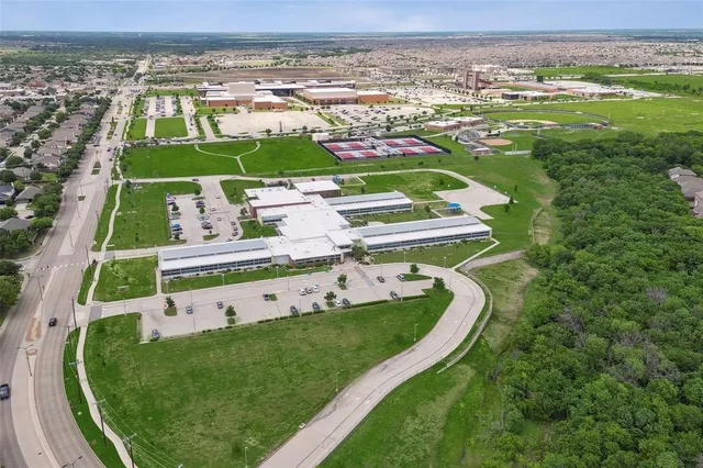 a view of a swimming pool with a yard