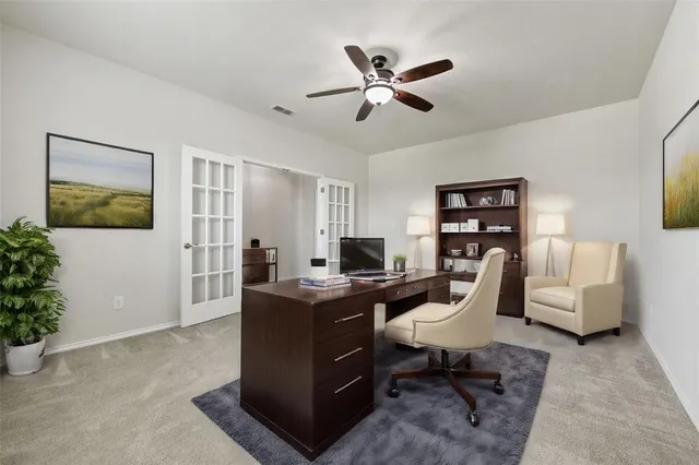 a view of a livingroom with workspace and a couch