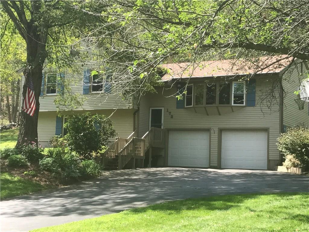 172 Machine Shop Hill Road Windham, CT 06266 - Photo 1 of 1 a front view of a house with a yard garage and outdoor seating