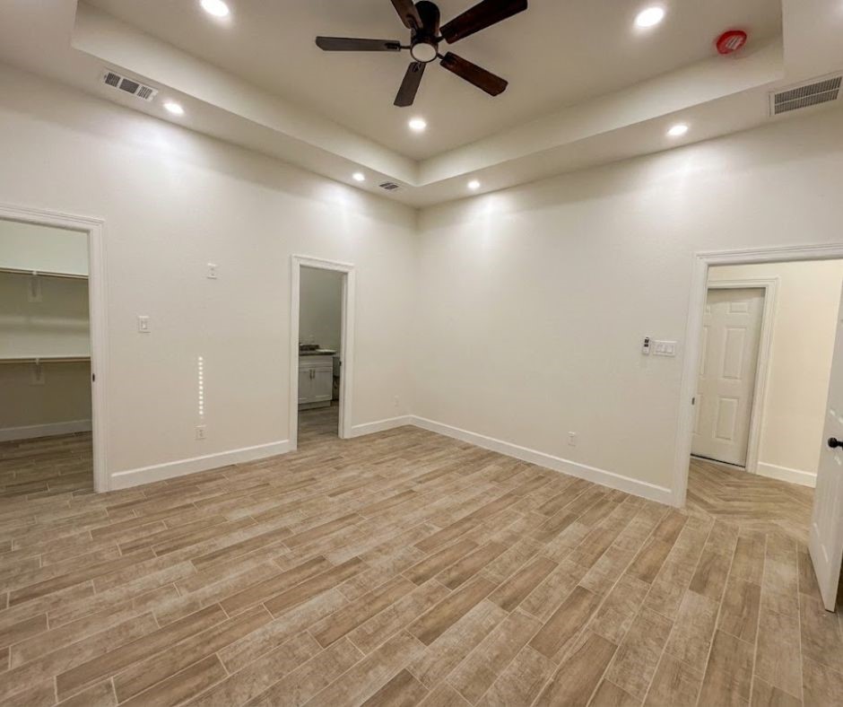 107 County Road 3372 Cleveland, TX 77327 - Photo 15 of 27 wooden floor in an empty room
