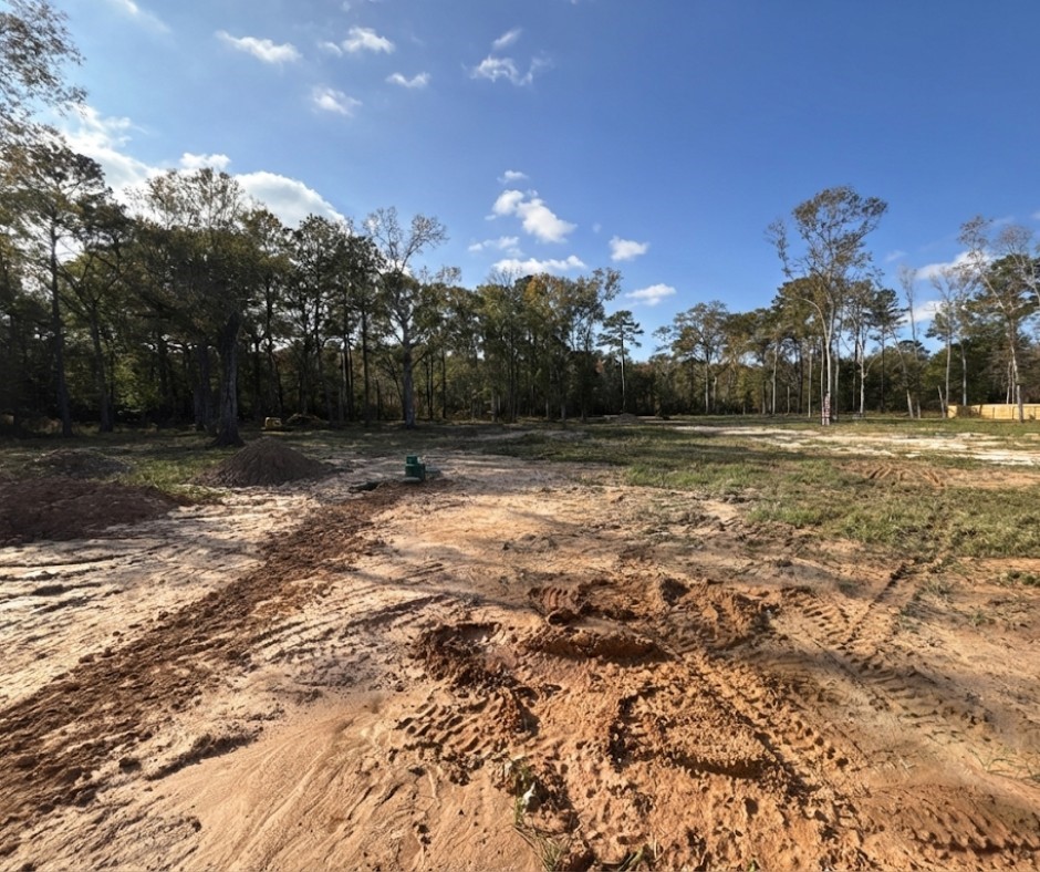 107 County Road 3372 Cleveland, TX 77327 - Photo 27 of 27 a view of outdoor space with trees