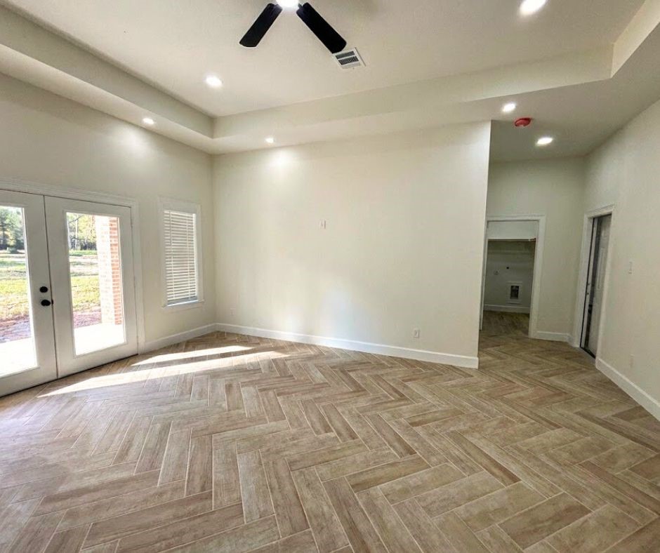 107 County Road 3372 Cleveland, TX 77327 - Photo 9 of 27 a view of an empty room and window