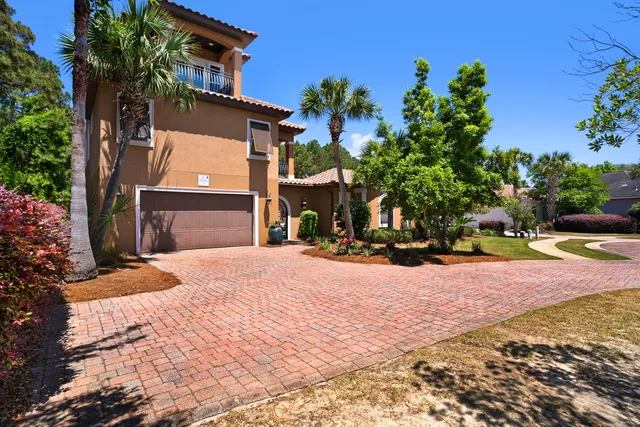 a view of a house with a yard and garage