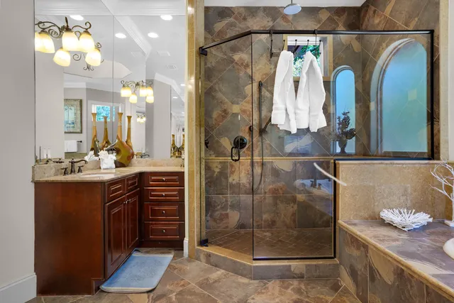 a bedroom with two beds and a flat screen tv