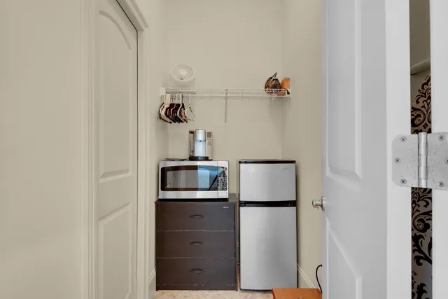 a view of a balcony with wooden floor and outdoor seating