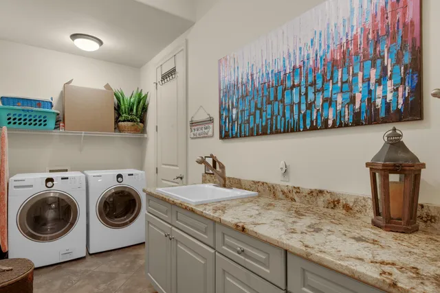 a view of a house with pool plants and palm trees