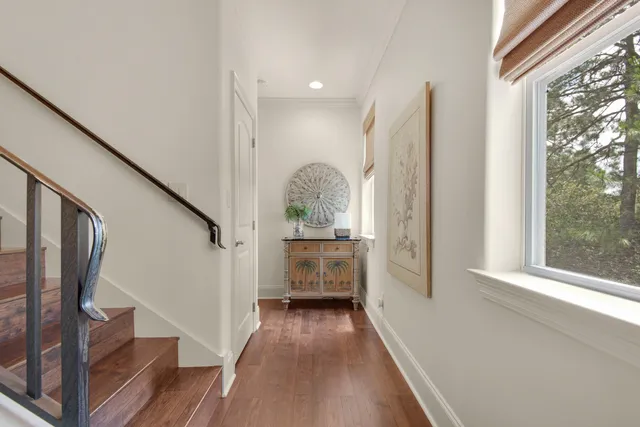 a view of a patio with table and chairs potted plants and palm trees