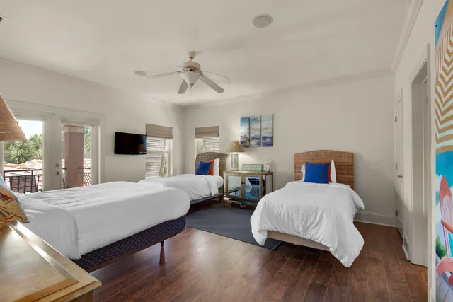 a patio with a table and chairs under an umbrella