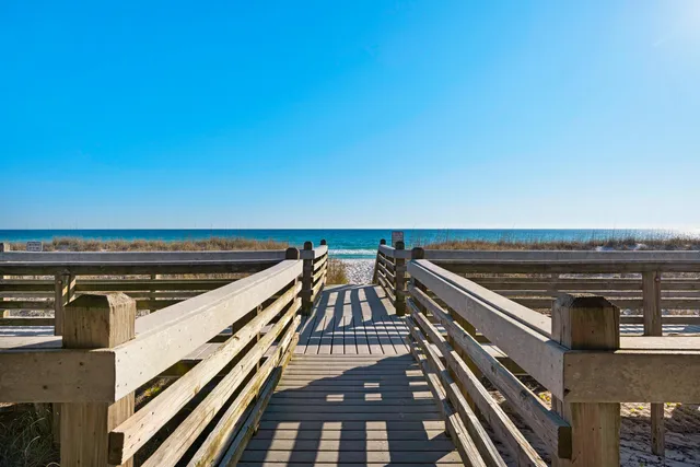 a view of a table and chairs under an umbrella