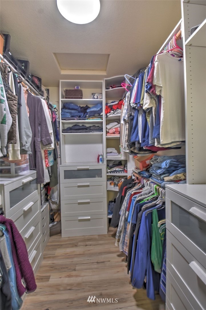 8637 183rd Avenue Southwest Rochester, WA 98579 - Photo 16 of 33 a view of walk in closet with clothes and shoes