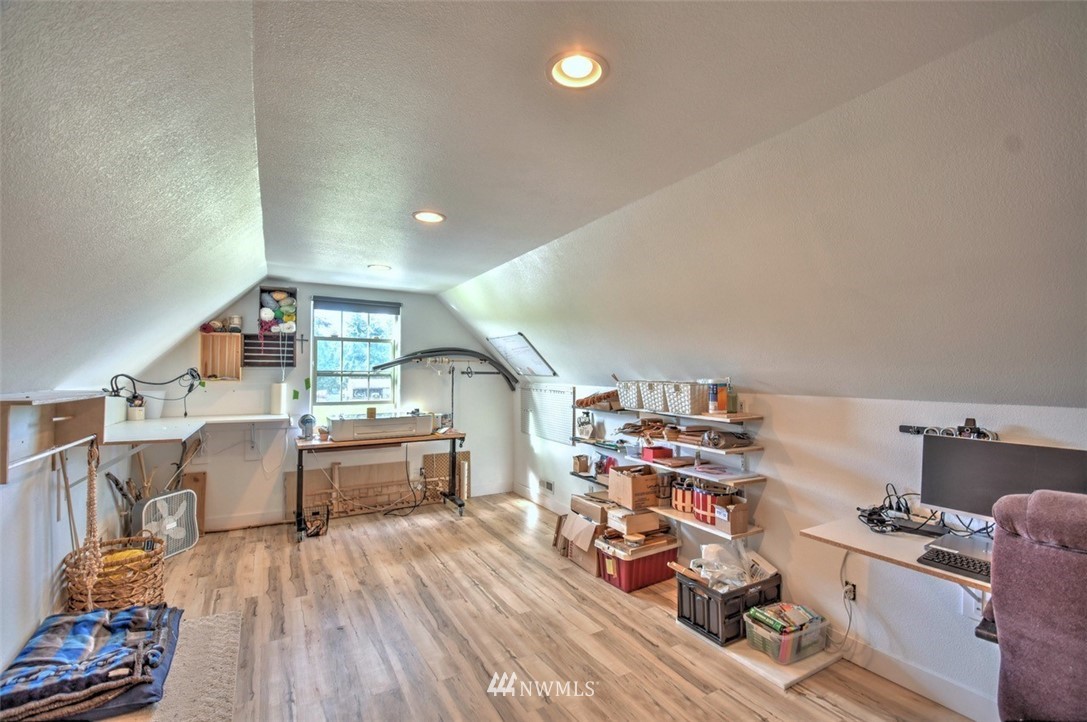 8637 183rd Avenue Southwest Rochester, WA 98579 - Photo 23 of 33 a kitchen view of a dining table chairs and wooden floor