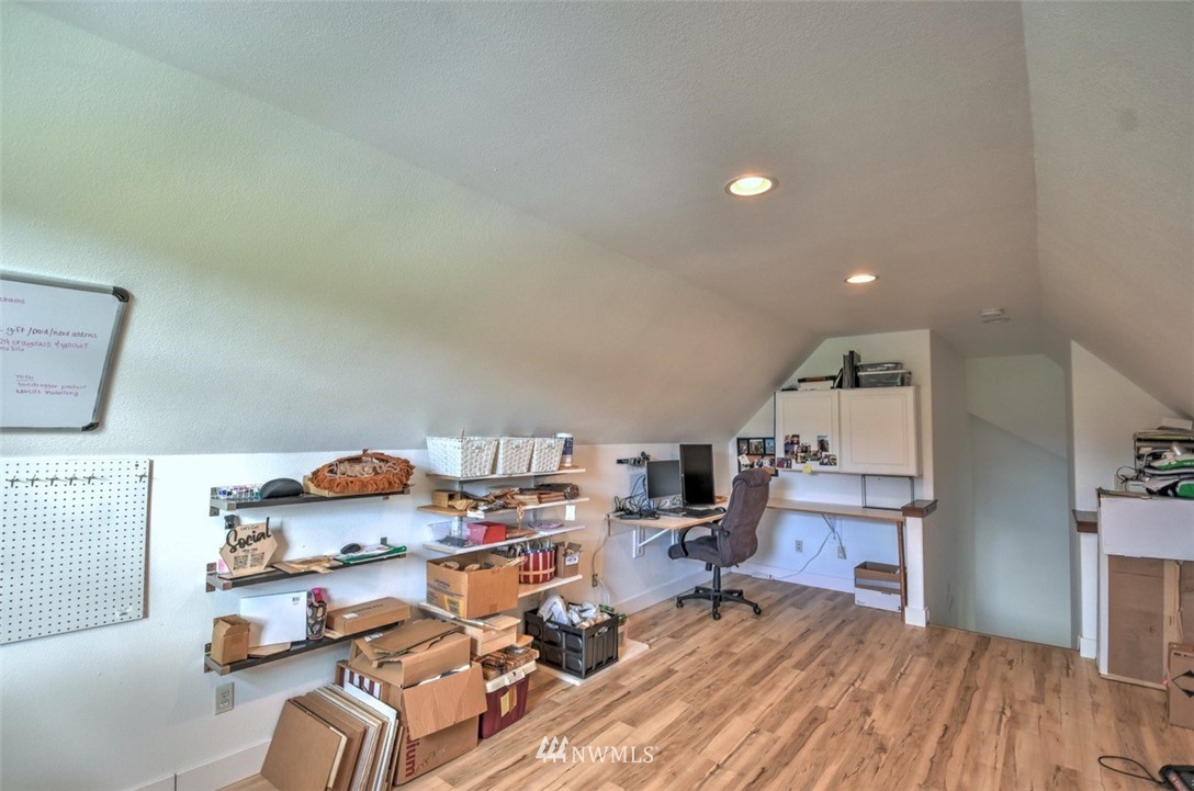 8637 183rd Avenue Southwest Rochester, WA 98579 - Photo 24 of 33 a workspace with furniture and wooden floor