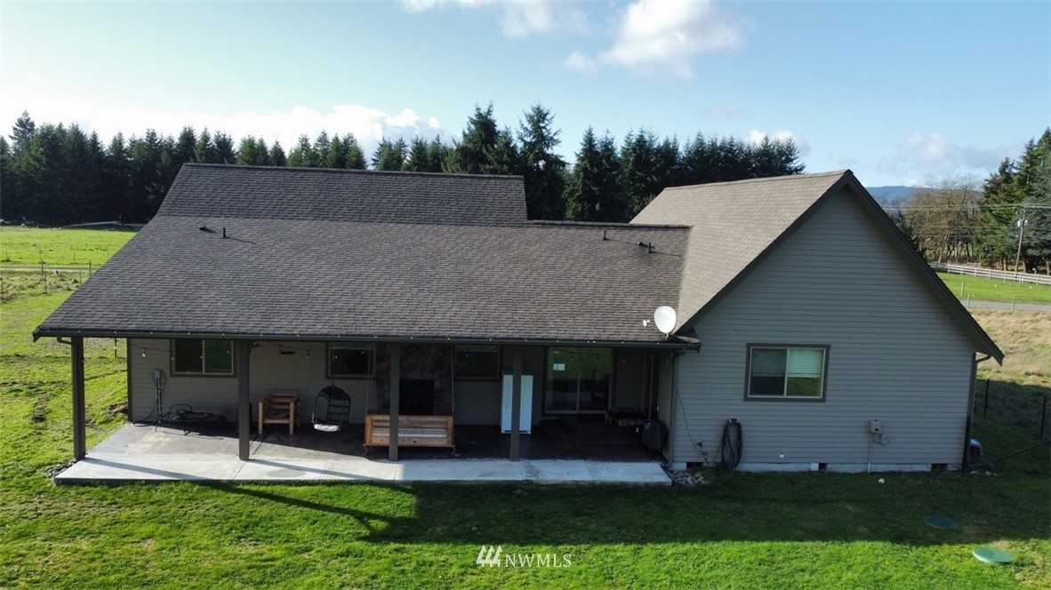 8637 183rd Avenue Southwest Rochester, WA 98579 - Photo 31 of 33 a view of a house with a yard and sitting area