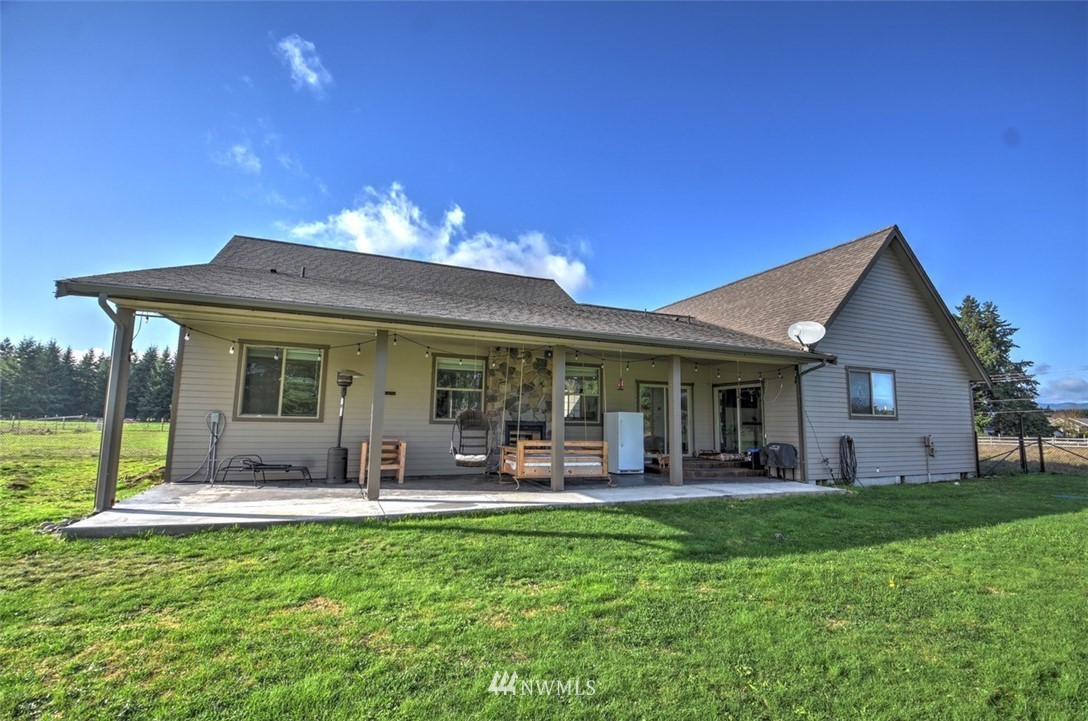 8637 183rd Avenue Southwest Rochester, WA 98579 - Photo 32 of 33 a front view of house with yard and outdoor seating