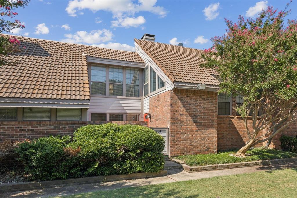 18240 Midway Road, Unit 904 Dallas, TX 75287 - Photo 2 of 26 a view of a house with a yard