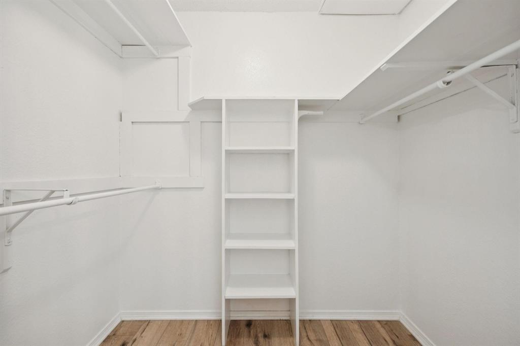 18240 Midway Road, Unit 904 Dallas, TX 75287 - Photo 23 of 26 a view of walk in closet with empty racks