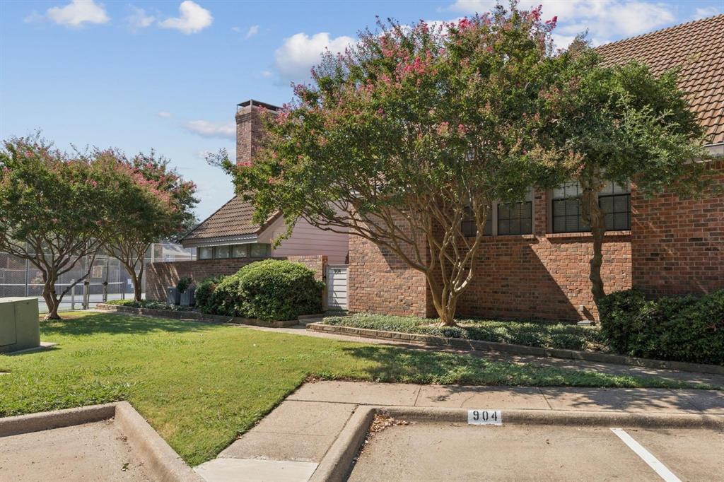 18240 Midway Road, Unit 904 Dallas, TX 75287 - Photo 26 of 26 front view of house with a yard