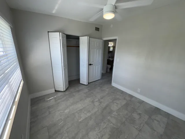 a view of an empty walk in closet