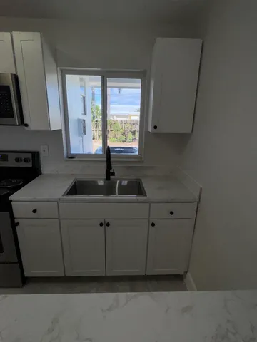 a view of an empty room with a window