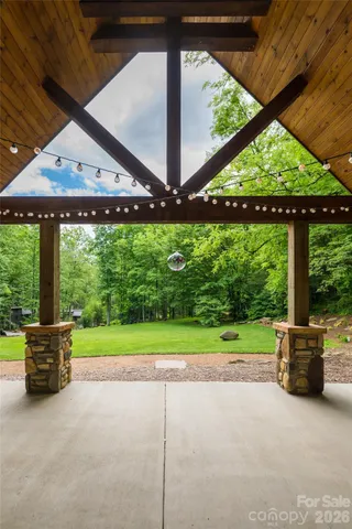 a view of a porch with wooden floor and a table
