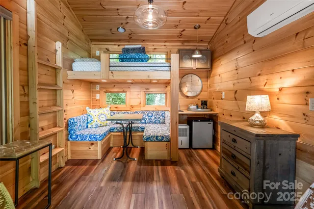 a view of a porch with wooden floor and a table