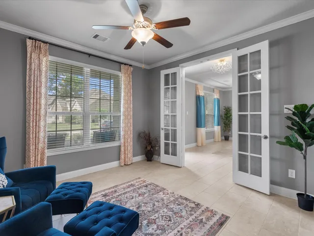 a living room with furniture and a large window