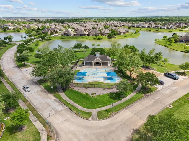 a view of a park with large trees