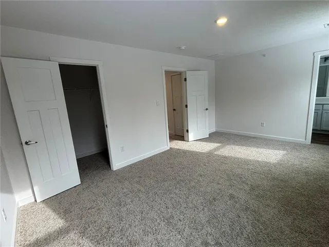 a bathroom with a sink toilet a mirror and shower