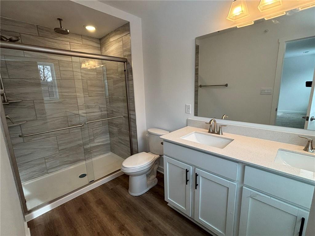 182 Lockheed Drive Coraopolis, PA 15108 - Photo 16 of 22 a bathroom with a sink toilet a mirror and shower