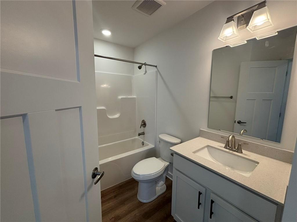 182 Lockheed Drive Coraopolis, PA 15108 - Photo 17 of 22 a bathroom with a toilet a sink a mirror and a shower