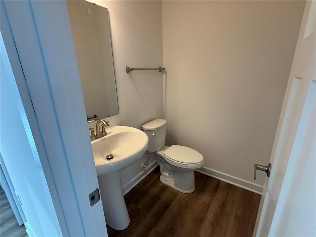 182 Lockheed Drive Coraopolis, PA 15108 - Photo 5 of 22 a bathroom with a toilet sink a mirror and vanity