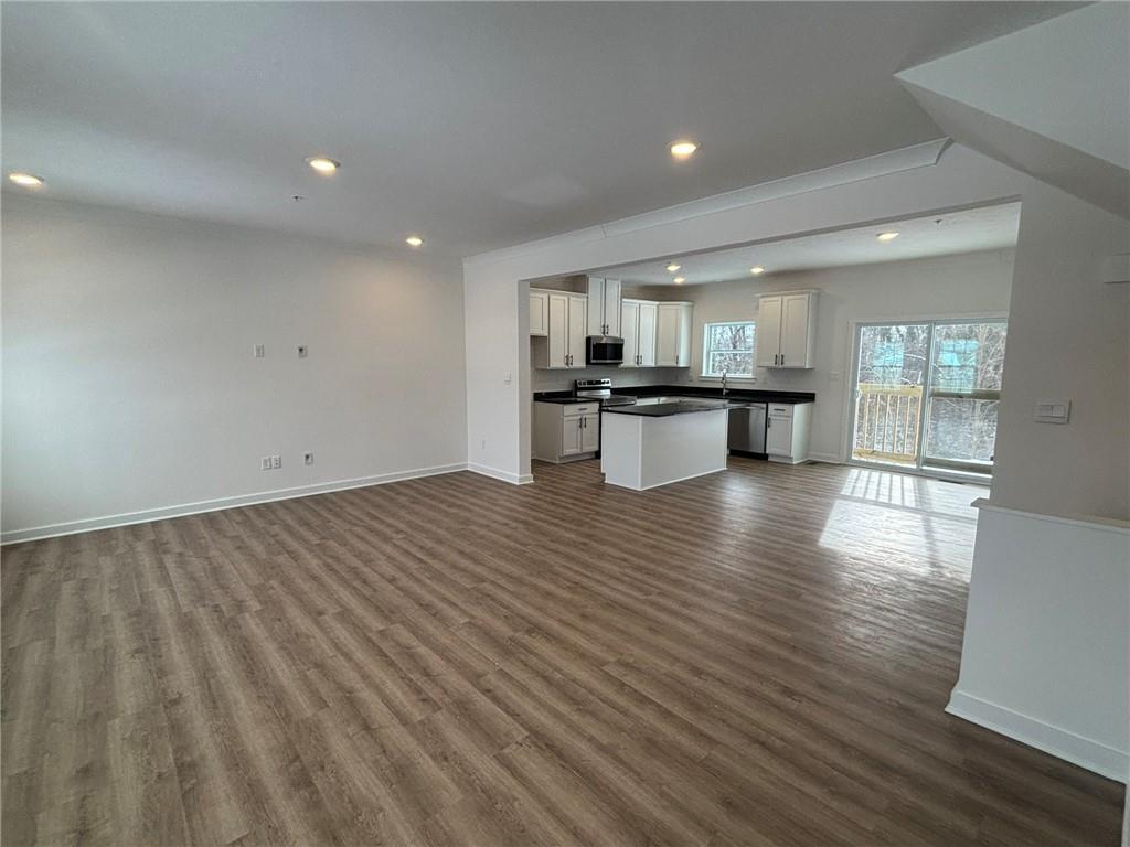 182 Lockheed Drive Coraopolis, PA 15108 - Photo 10 of 22 a kitchen with stainless steel appliances wooden floor and large window
