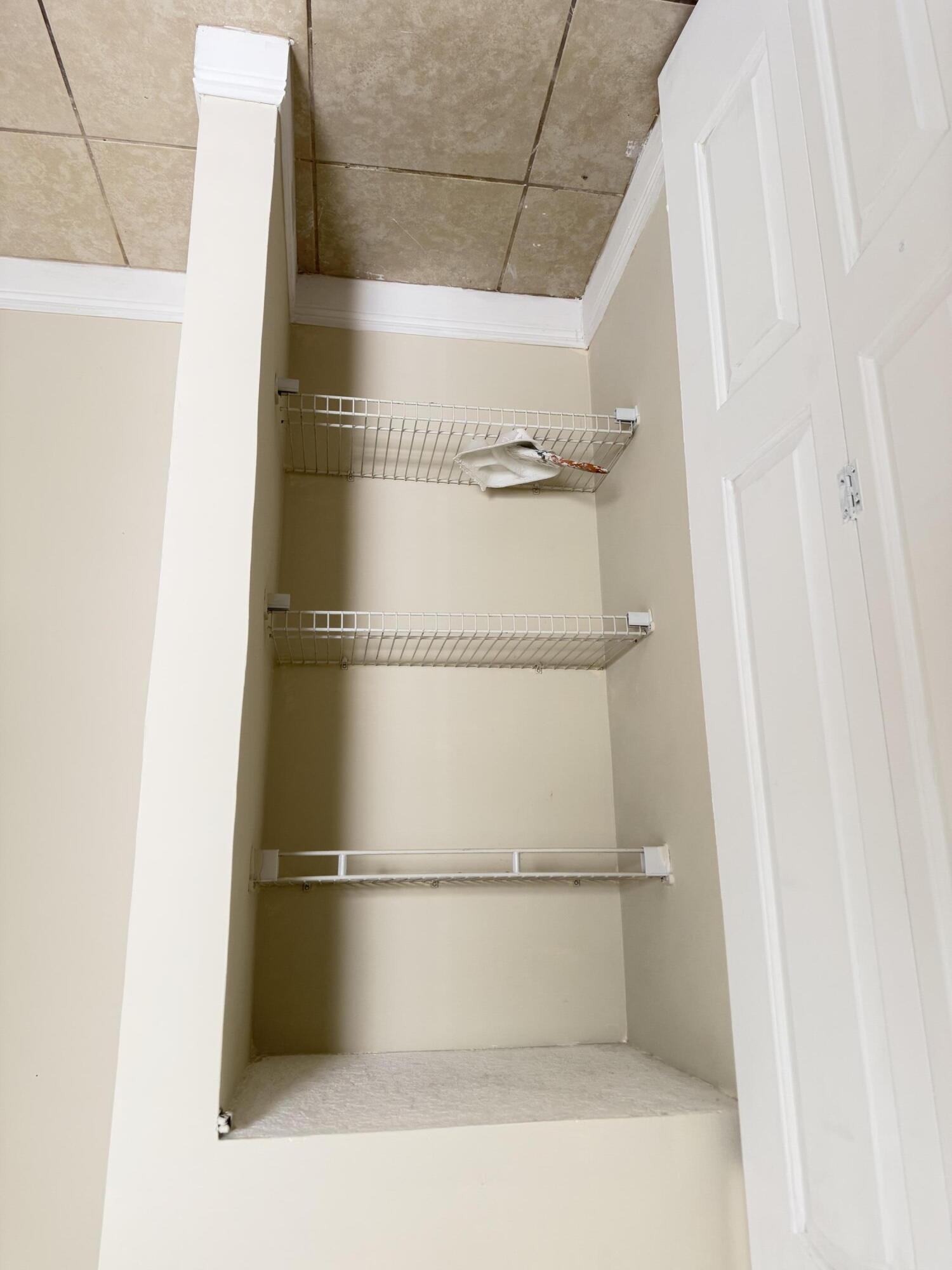 520 Seagrape Road Lantana, FL 33462 - Photo 14 of 16 a bathroom with a glass shower door