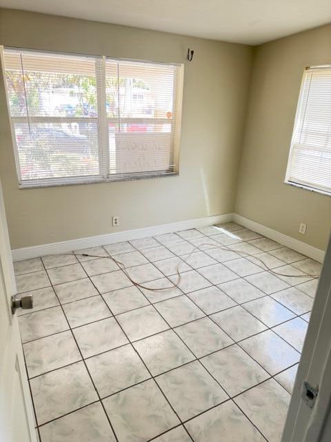 520 Seagrape Road Lantana, FL 33462 - Photo 8 of 16 a view of an empty room and window