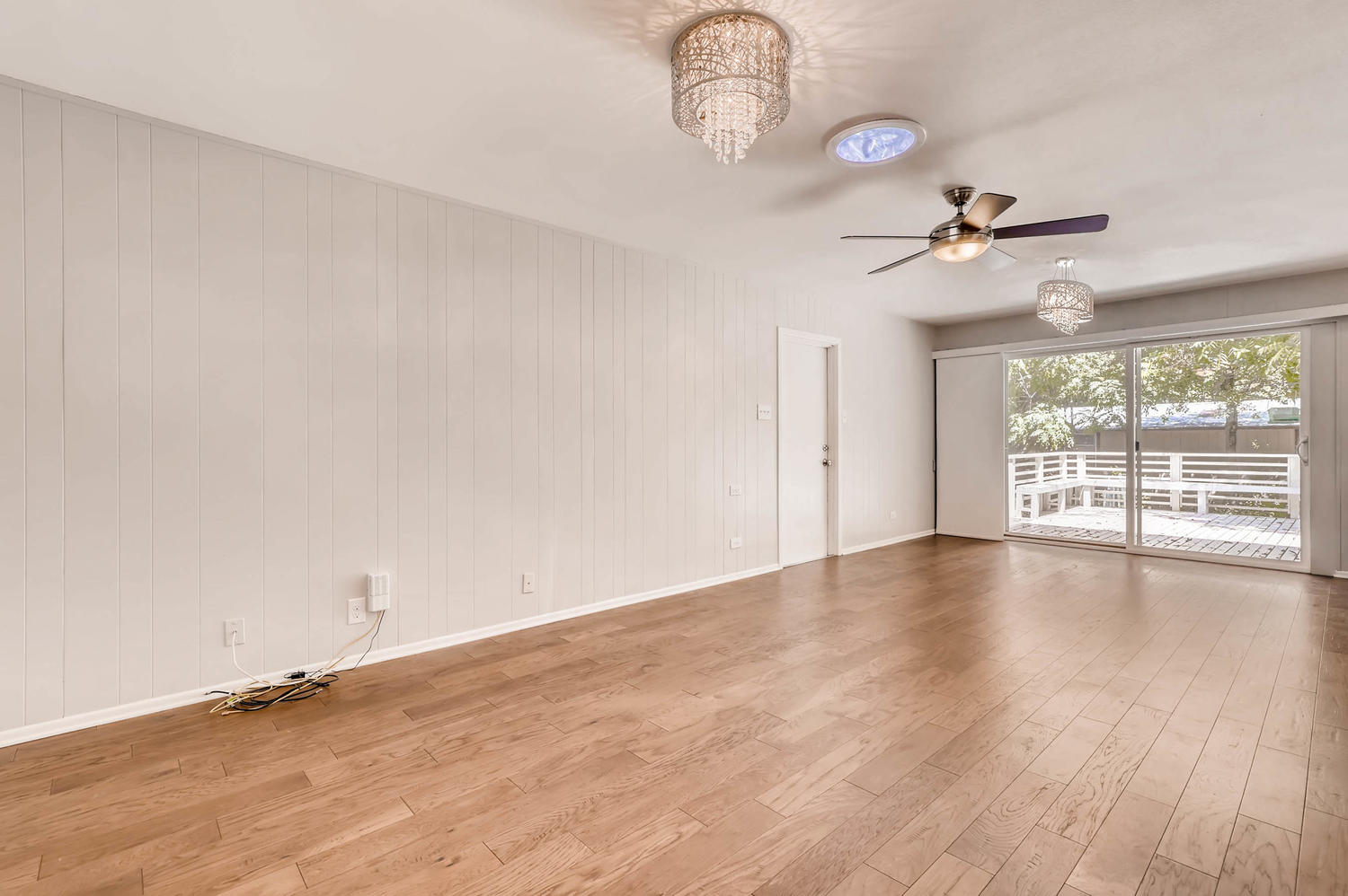 446 Pike Road San Antonio, TX 78209 - Photo 7 of 28 Hardwood floors and natural light fill this inviting living space with exterior deck access.